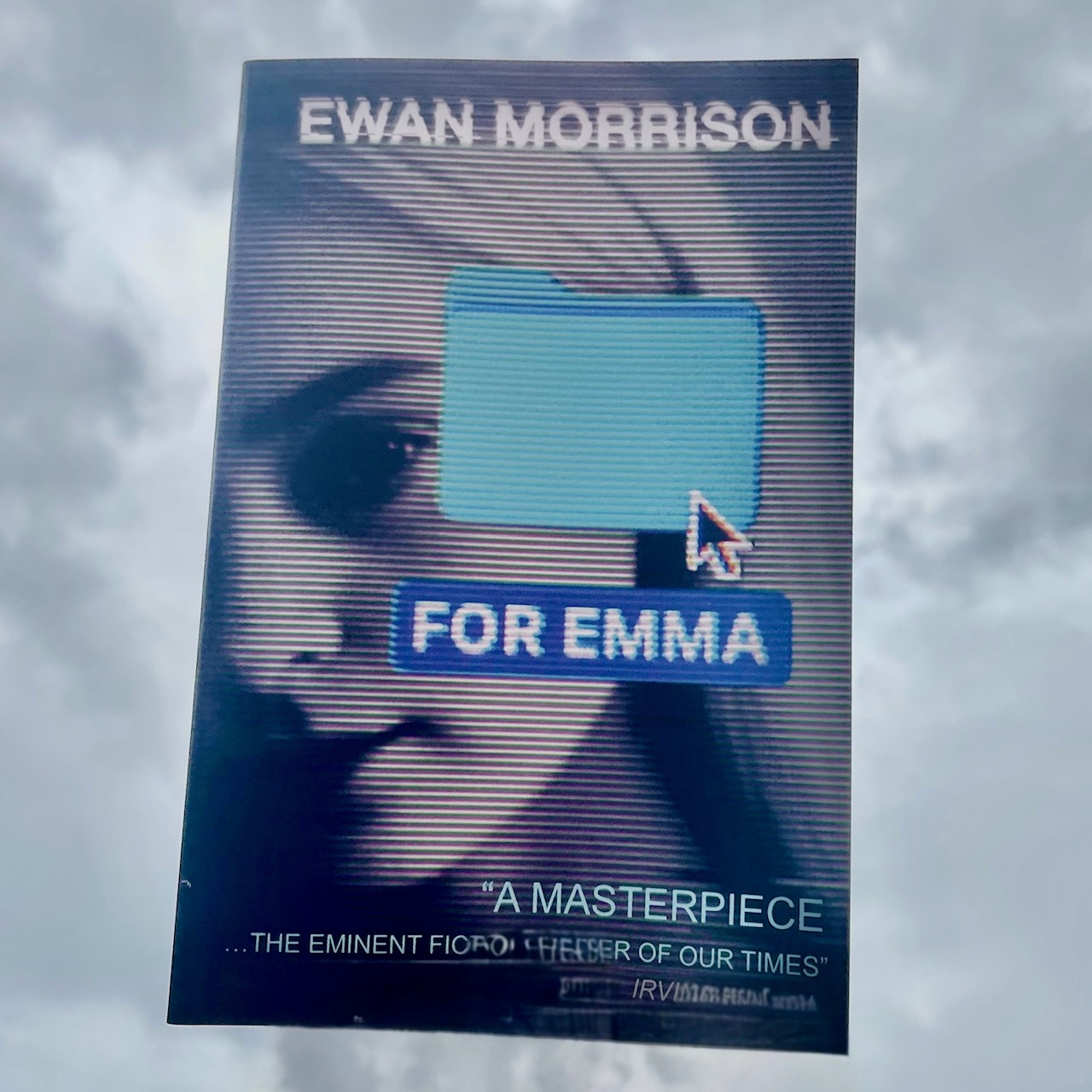 copy of for emma by ewan morrison floating in a grey scottish sky it is the best novel of 2025